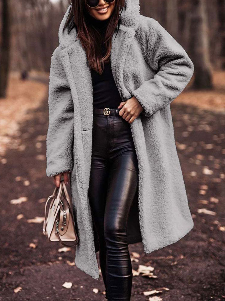 Rosamira hooded longline teddy coat in gray, walking pose with handbag