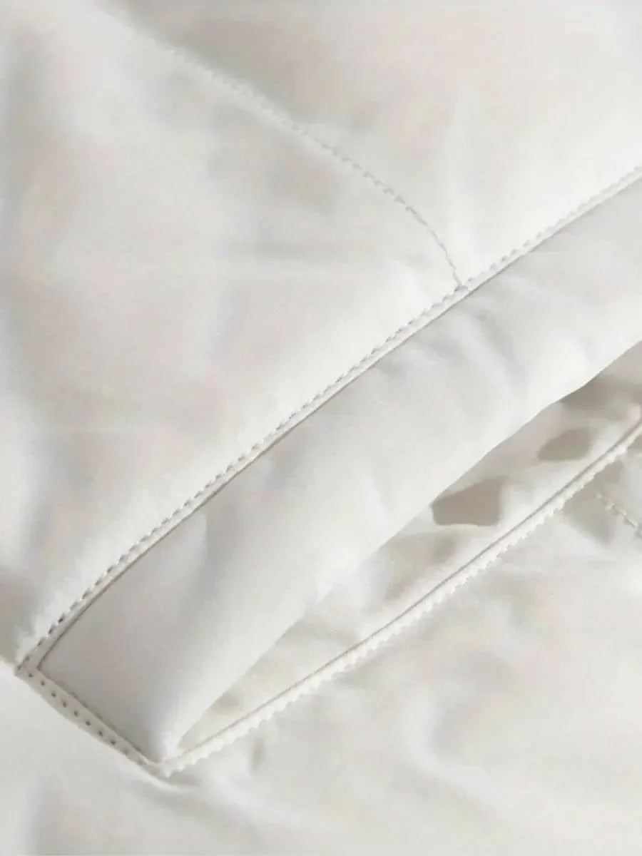 Close-up of elasticized cuff with drawstring toggle