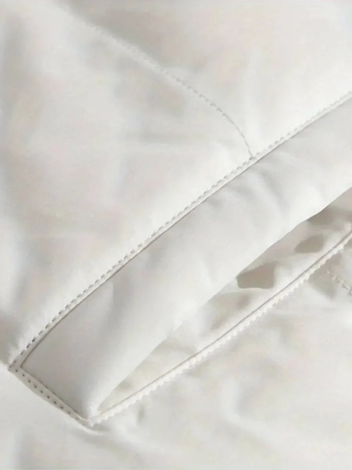 Close-up of elasticized cuff with drawstring toggle