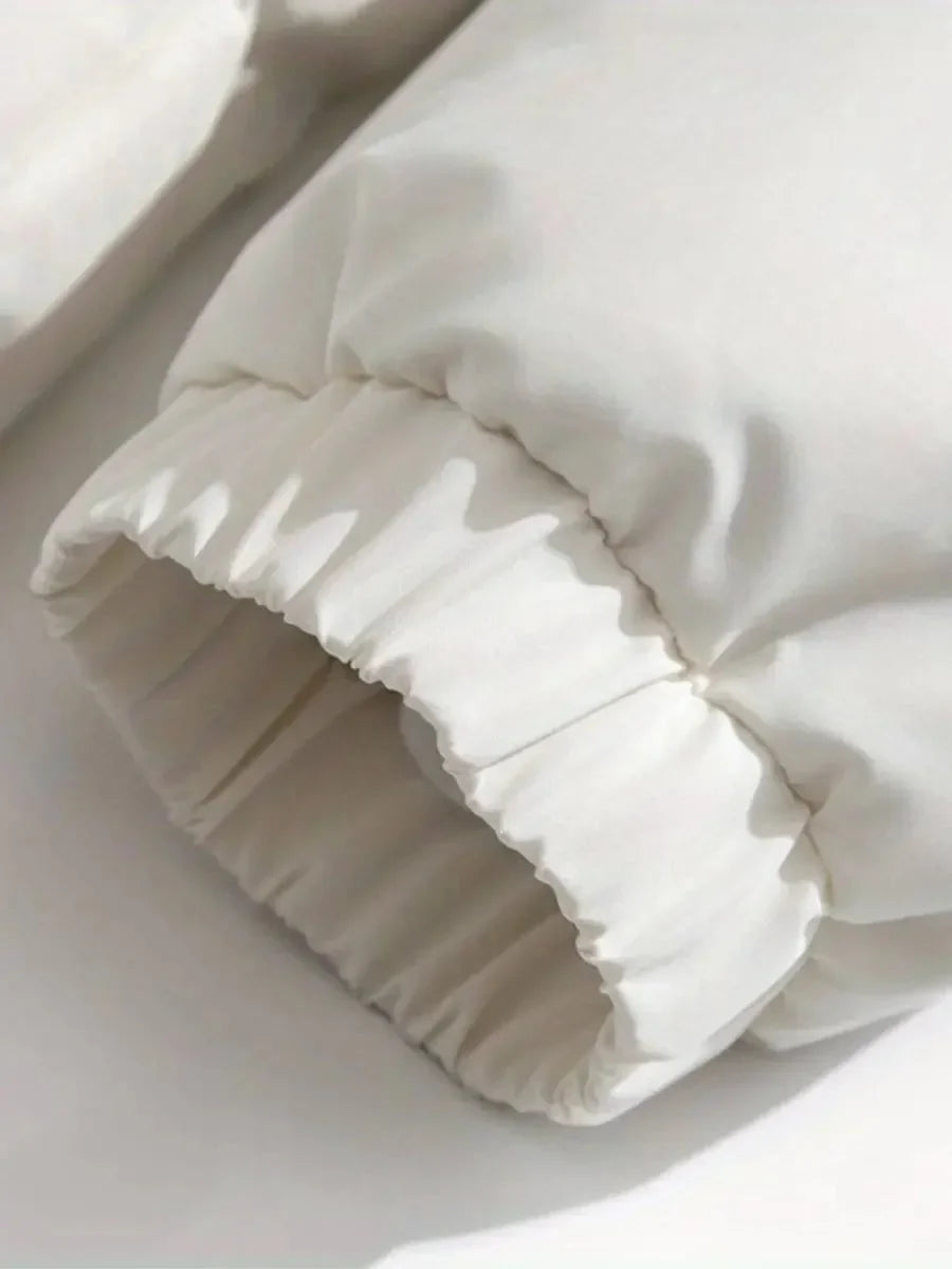 Close-up of elasticized cuff with drawstring toggle