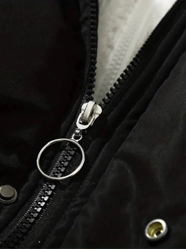 Close-up of zipper pull and snap button detail