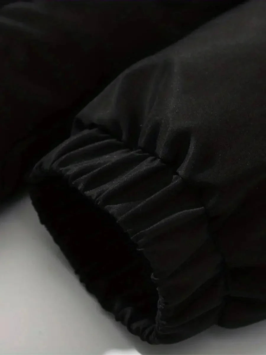 Close-up of elasticized cuff with drawstring toggle