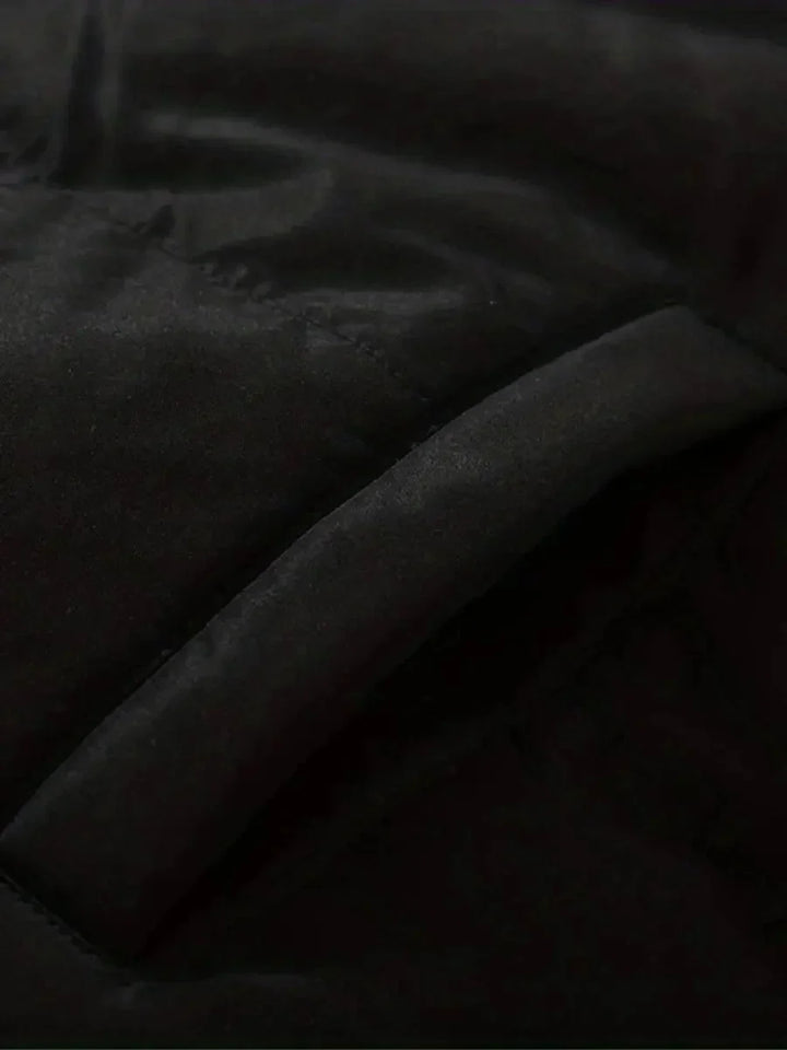 Close-up of elasticized cuff with drawstring toggle