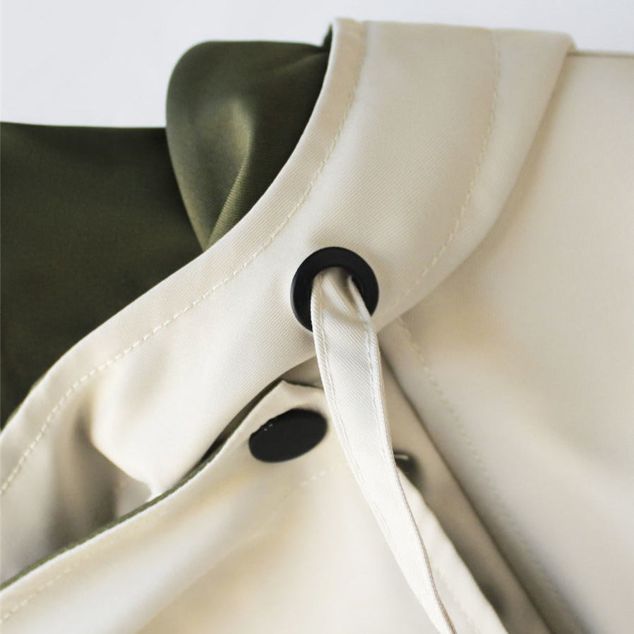 Rosamund jacket detail showing zip and snap closures