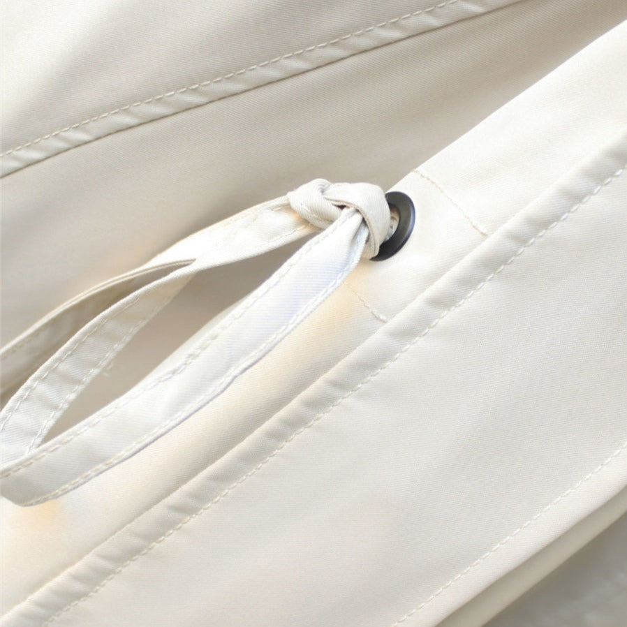 Rosamund jacket detail showing zip and snap closures