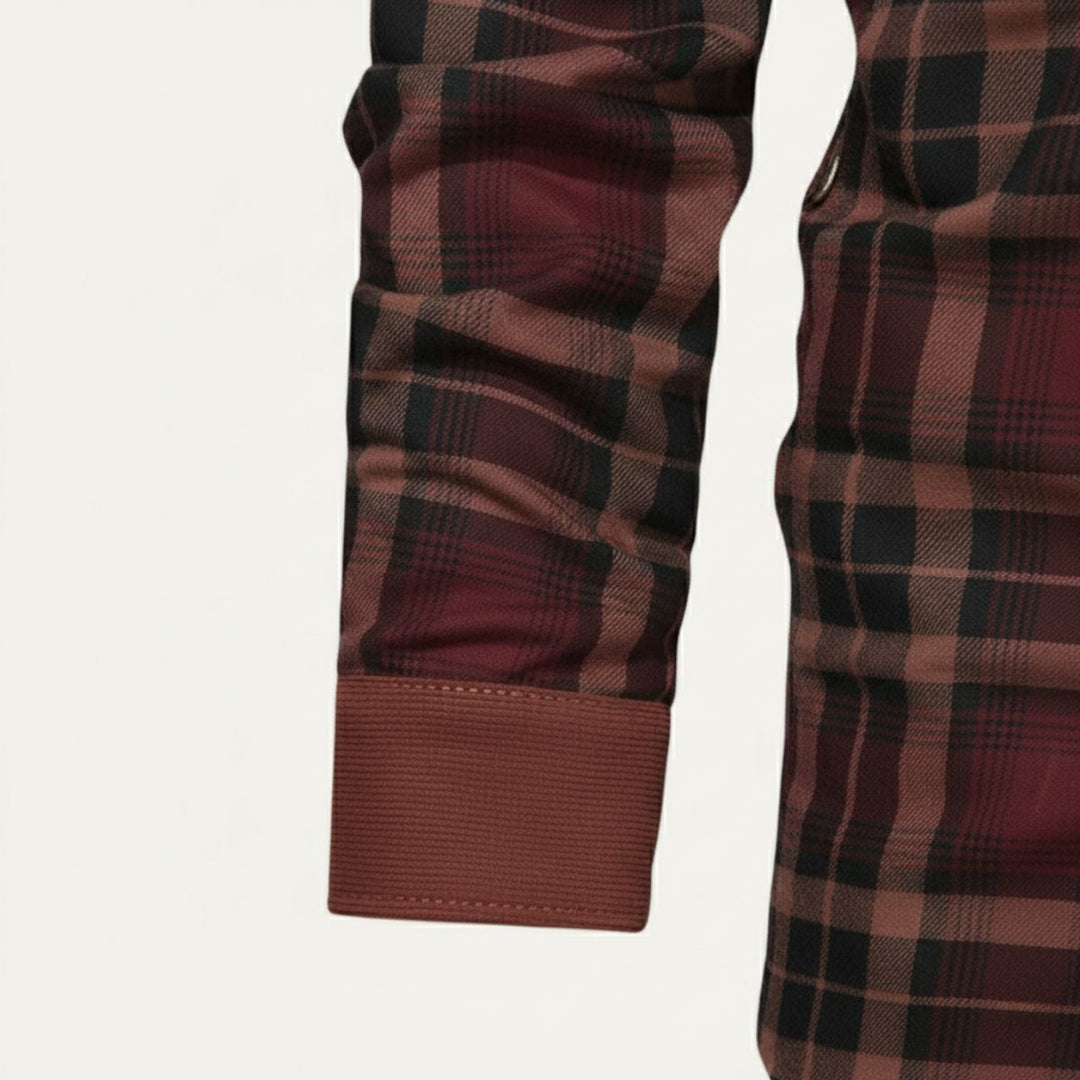 Close-up of Rowan burgundy plaid shirt jacket sleeve cuff and plaid pattern detail
