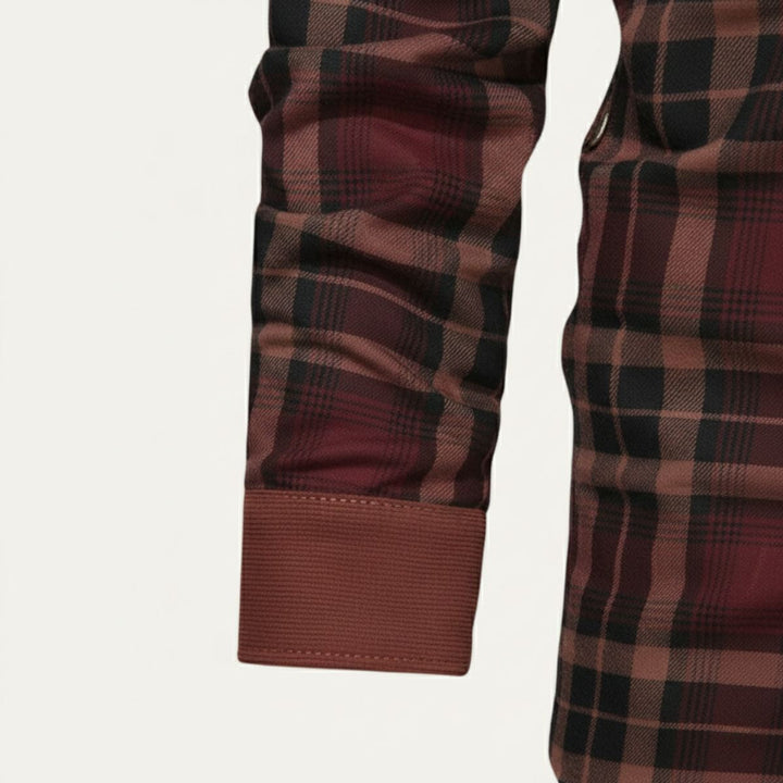 Close-up of Rowan burgundy plaid shirt jacket sleeve cuff and plaid pattern detail