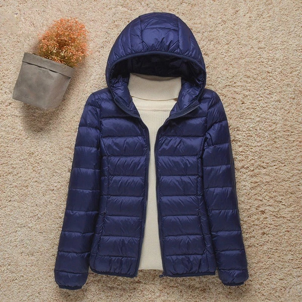 Seraphina lightweight hooded puffer jacket in navy blue, front view