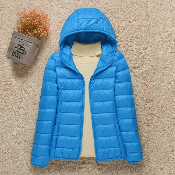 Seraphina lightweight hooded puffer jacket in light blue, front view