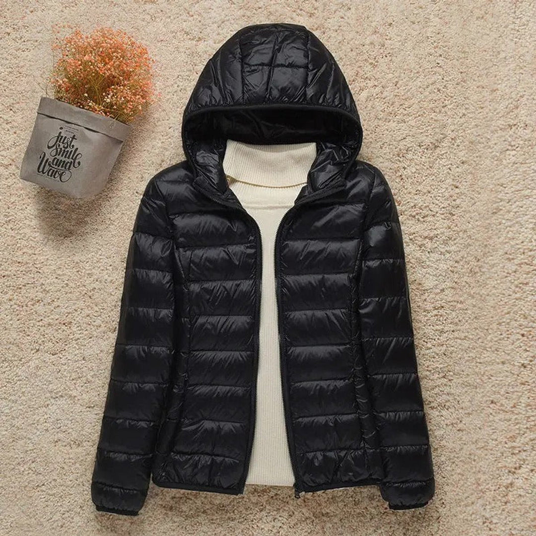 Seraphina lightweight hooded puffer jacket in black, front view