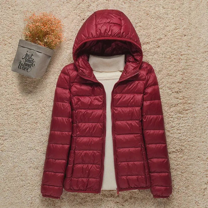Seraphina lightweight hooded puffer jacket in black, front view