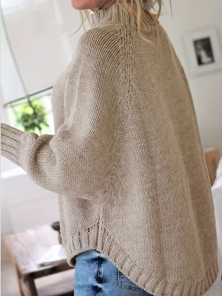 Sylvie oversized cable-knit high-neck sweater in gray, back view