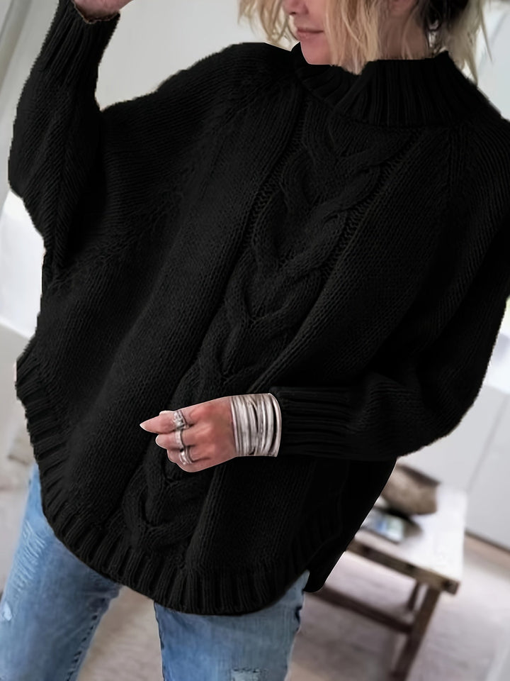 Sylvie oversized cable-knit high-neck sweater in black, front view