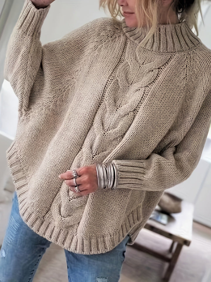 Sylvie oversized cable-knit high-neck sweater in gray, back view