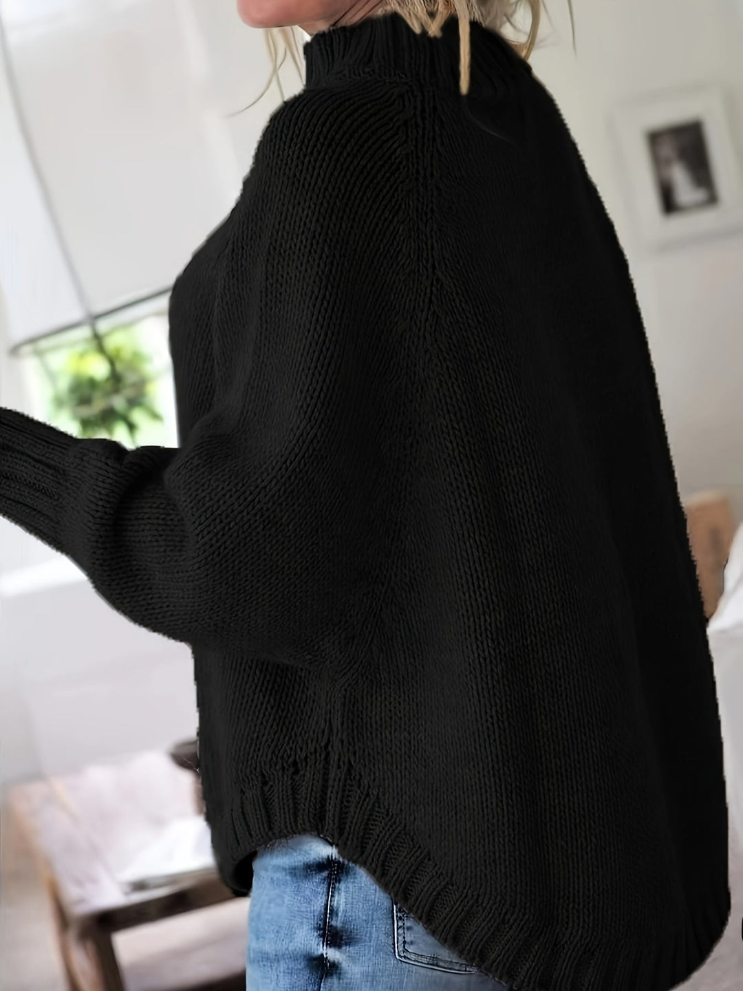 Sylvie oversized cable-knit high-neck sweater in gray, back view