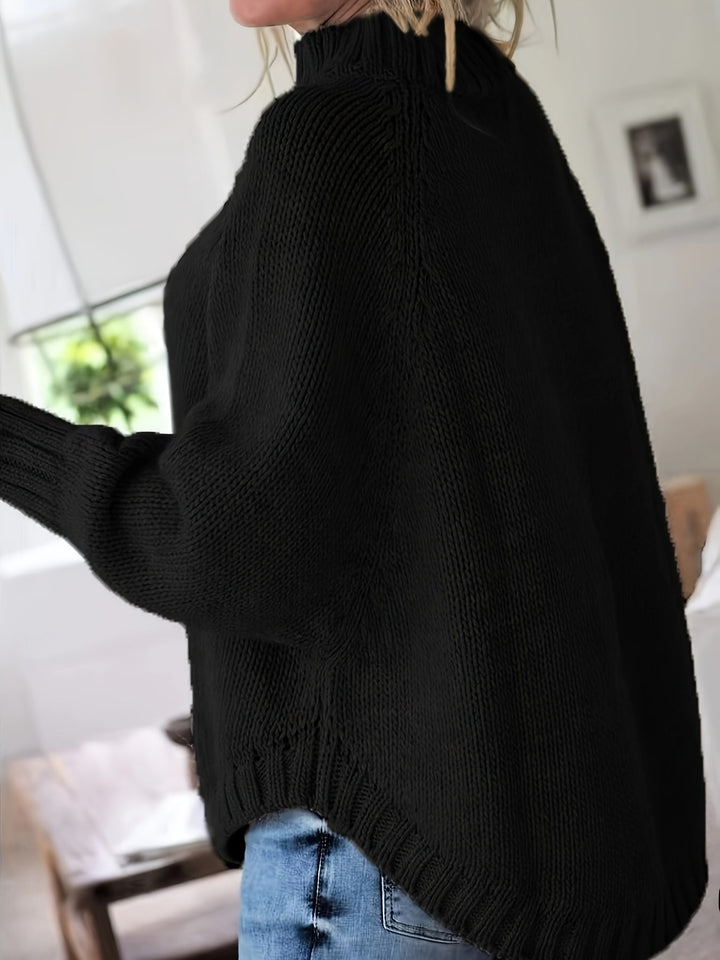 Sylvie oversized cable-knit high-neck sweater in gray, back view