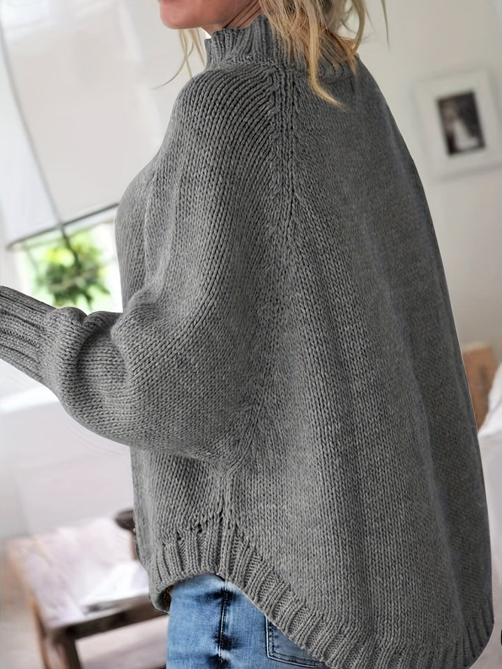 Sylvie oversized cable-knit high-neck sweater in gray, back view