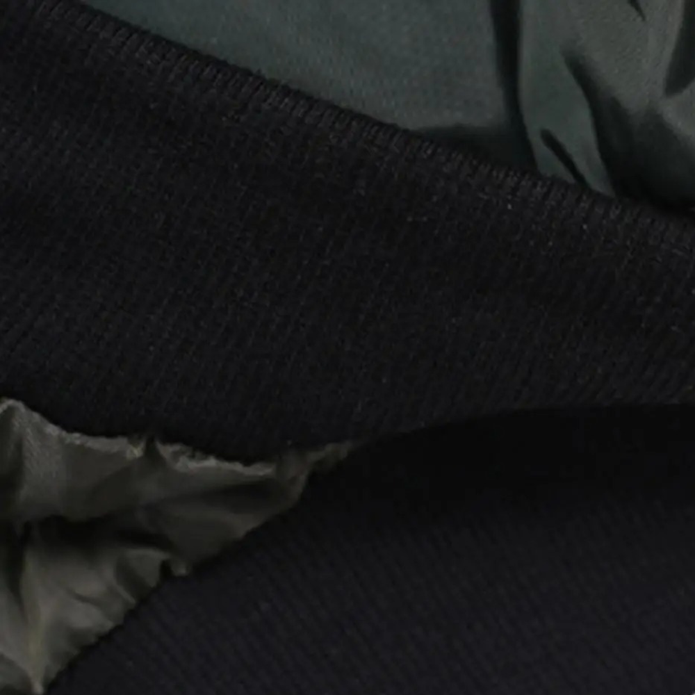 Close-up of ribbed cuff and hem detail on Talulla bomber jacket