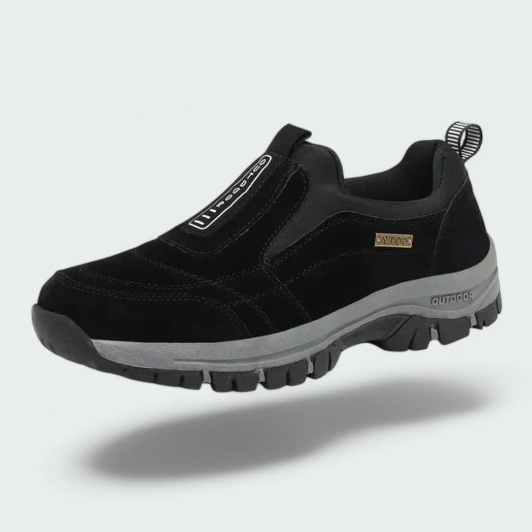 Thaddeus orthopedic slip-on walking sneaker in black suede, floating side angle view
