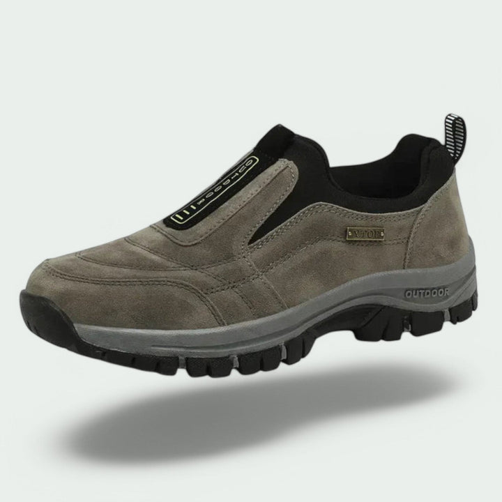 Thaddeus orthopedic slip-on walking sneaker in gray suede, floating side angle view