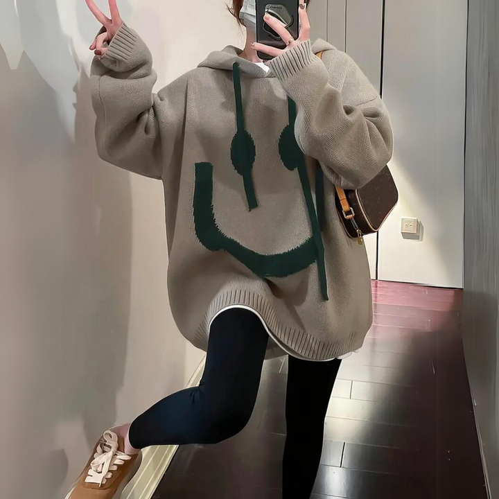 Thomasina oversized smiley hoodie in khaki, side view with drawstring hood
