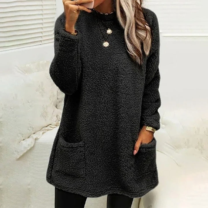 Winnifred cozy pocket sweater in navy blue, front view