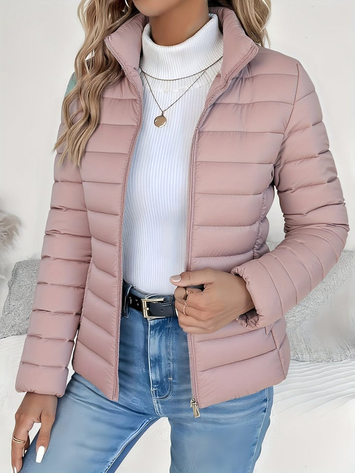 Wren quilted puffer jacket in pink with stand collar and zip closure, close-up view